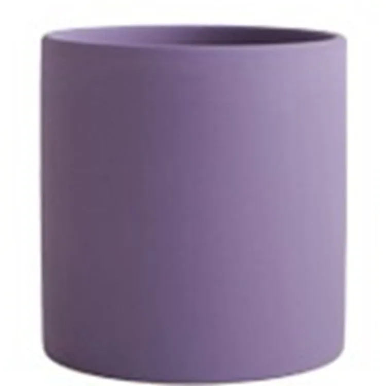 Cylindrical ceramic succulent planter with drainage hole in Nordic style, shown in a selected colour.