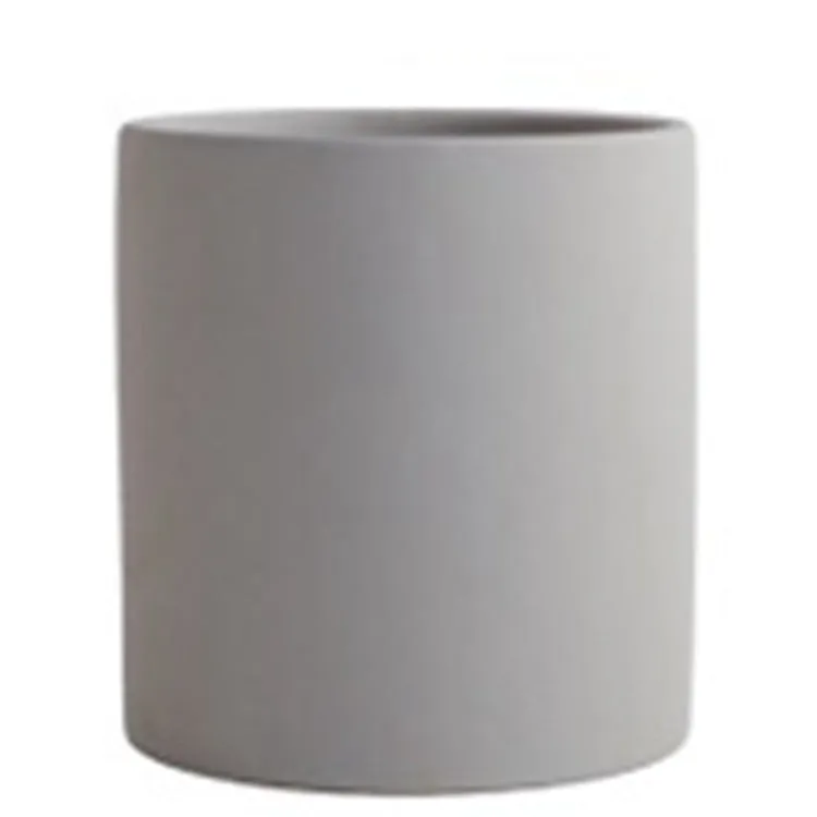 Cylindrical ceramic succulent planter with drainage hole in Nordic style, shown in a selected colour.