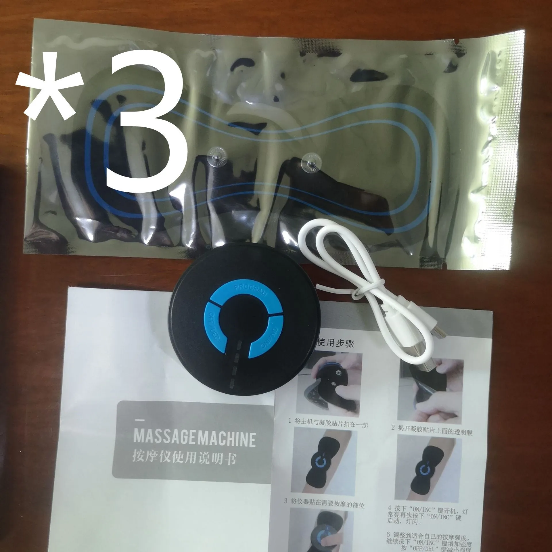Black HQ-185 mini electric shoulder and neck massager with massage patch, shown next to a ruler for scale.