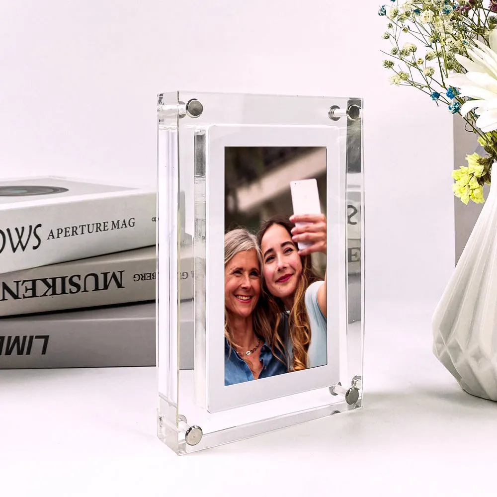 White acrylic digital picture frame with 5 inch vertical screen on a table