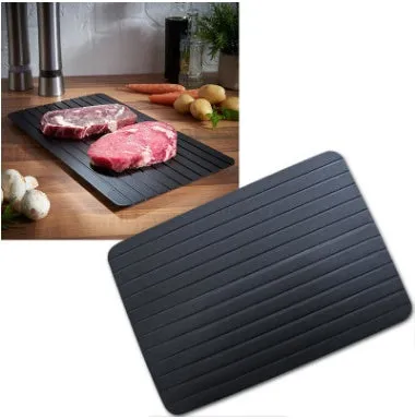 Black aluminium quick defrosting tray for thawing frozen meat and food without electricity.
