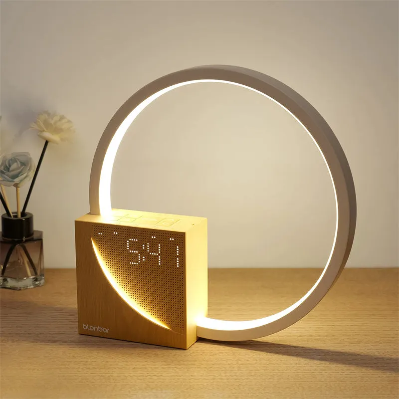 Navy blue touch control bedside lamp with digital alarm clock display on wooden table