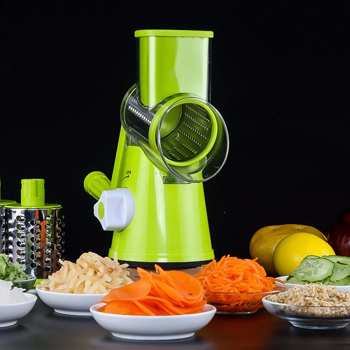 Round vegetable mandoline slicer with stainless steel blades and suction base in green colour