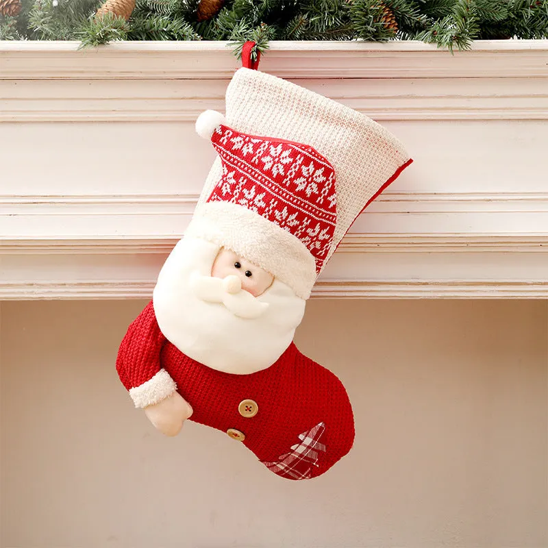 Large red and white knitted Christmas stocking with Santa Claus design hanging on fireplace