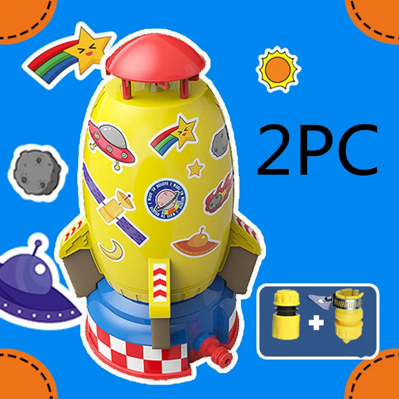 Yellow water pressure rocket launcher toy with base and interface connectors for outdoor garden play