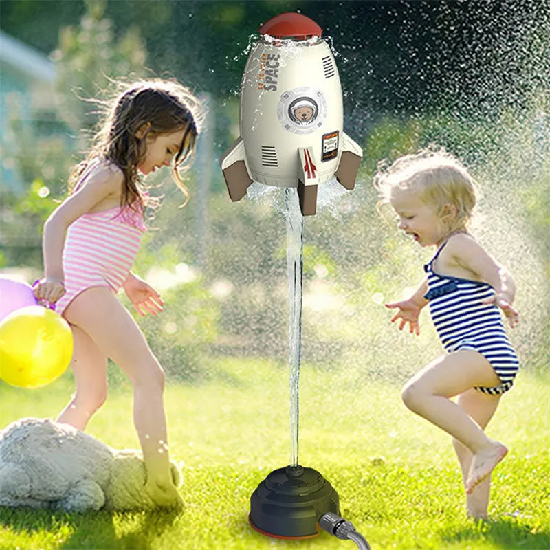 Yellow water pressure rocket launcher toy with base and interface connectors for outdoor garden play