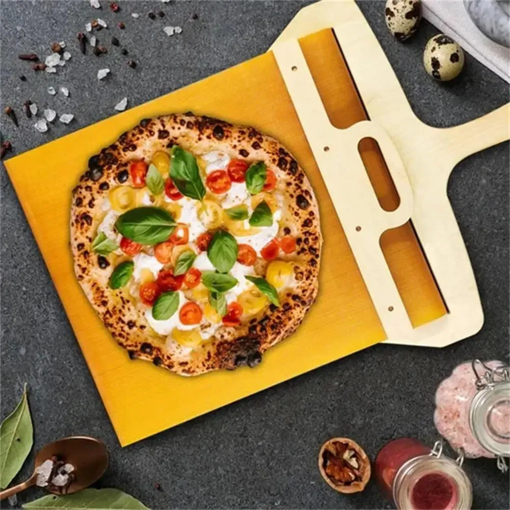 Wooden pizza transfer shovel with cutting board surface and hanging hole