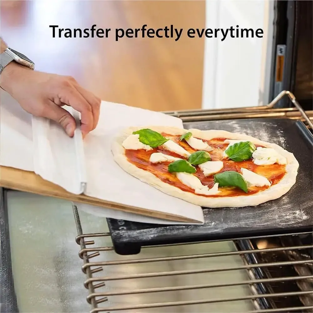 Wooden pizza transfer shovel with cutting board surface and hanging hole