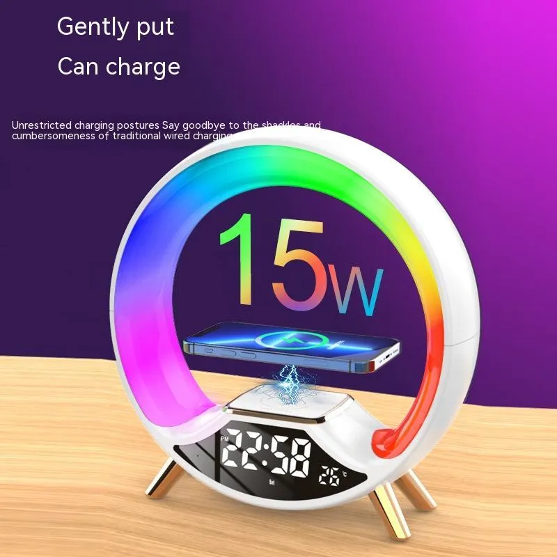 LED Colourful Music Atmosphere Clock in black, a wireless charging night light with Bluetooth speaker and digital display.