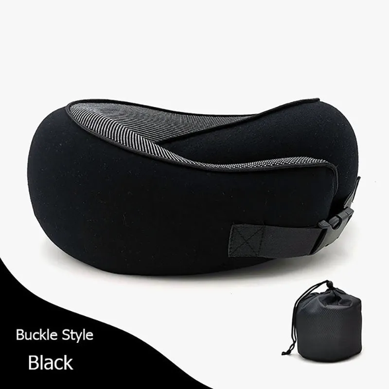 Navy blue U-shaped memory foam travel neck pillow rolled up next to its carry bag.