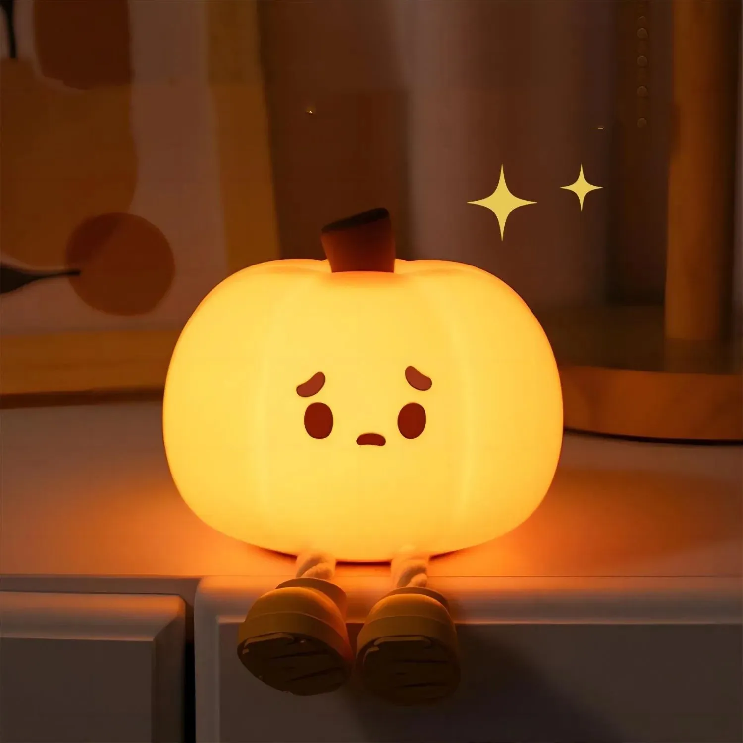 Orange pumpkin silicone night light with soft glowing illumination and touch controls