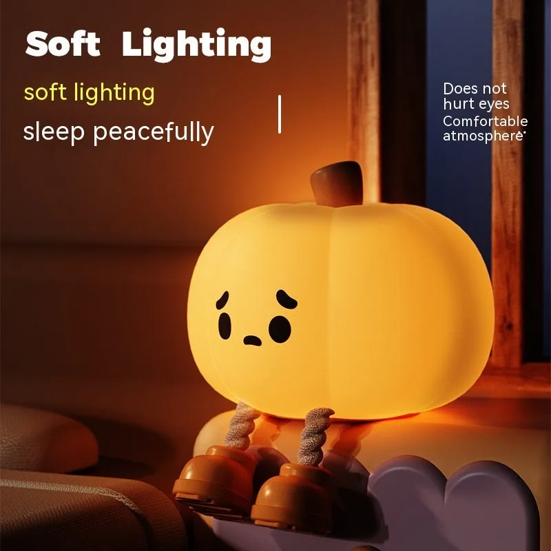 Orange pumpkin silicone night light with soft glowing illumination and touch controls