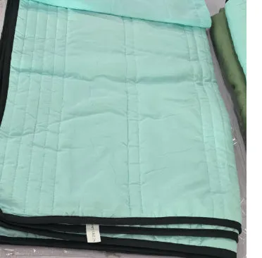 Pure colour seersucker cooling quilt laid flat, showing quilted texture and simple edging.