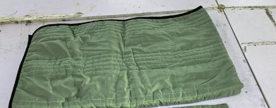 Pure colour seersucker cooling quilt laid flat, showing quilted texture and simple edging.