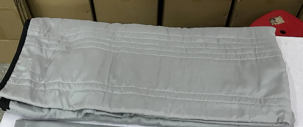Pure colour seersucker cooling quilt laid flat, showing quilted texture and simple edging.