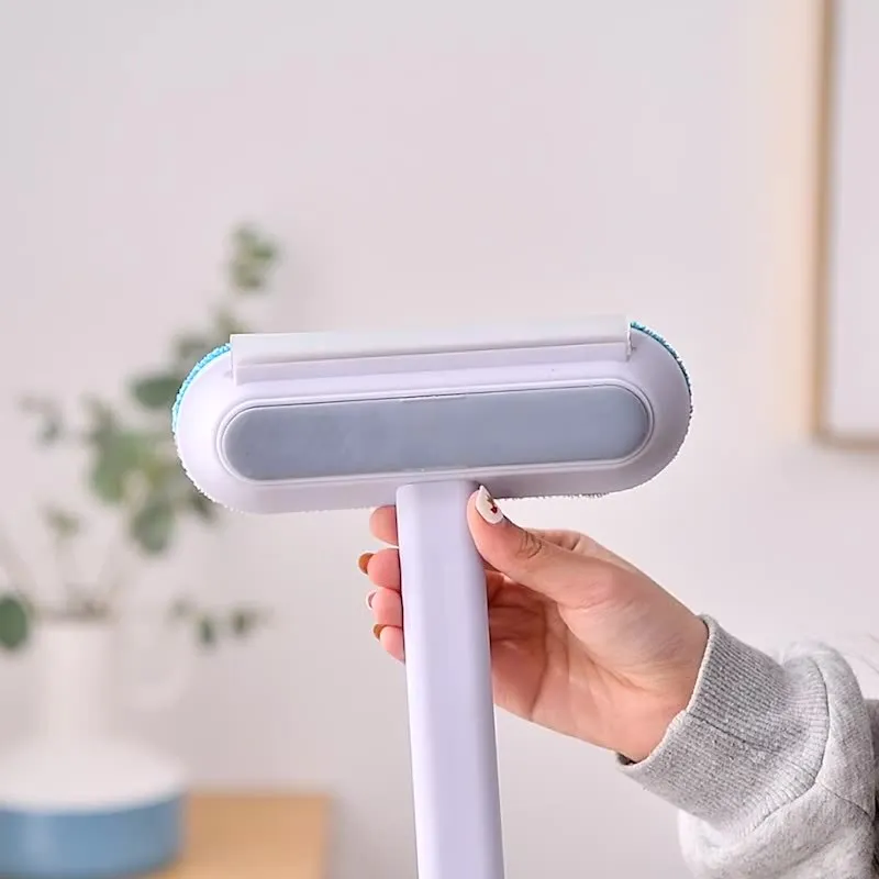 Multifunctional 4-in-1 screen cleaner and pet hair remover brush with flannel head and extension handle.