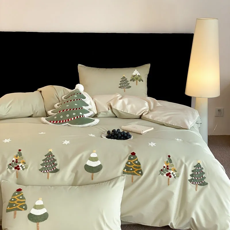 Cream blue duvet cover with raised towel embroidery of Christmas trees and flowers, part of a four-piece pure cotton bedding set.