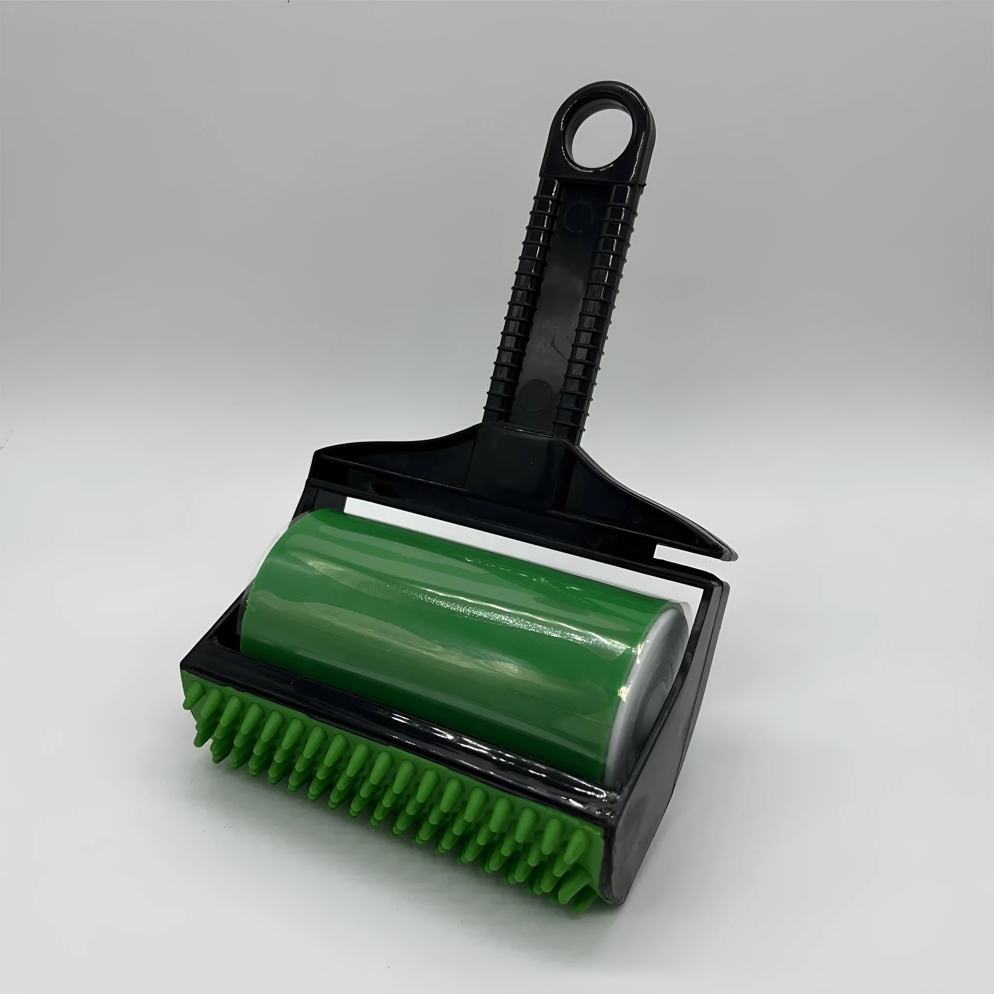Yellow and green portable washable lint roller for removing pet hair from fabrics.