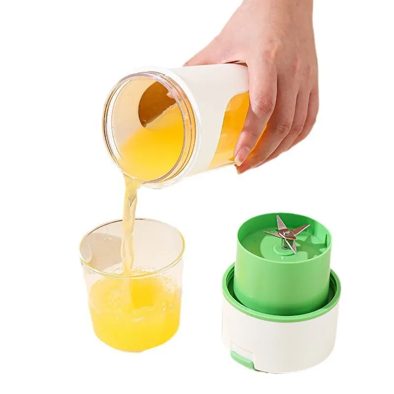 Blue portable USB electric blender juicer with 400ml plastic cup on a table.