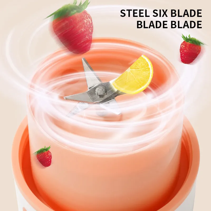 Blue portable USB electric blender juicer with 400ml plastic cup on a table.