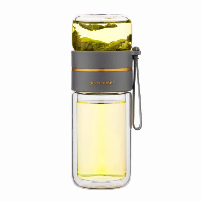 Green double-wall glass water bottle with a stainless steel tea infuser insert and a black leak-proof lid with rope handle.