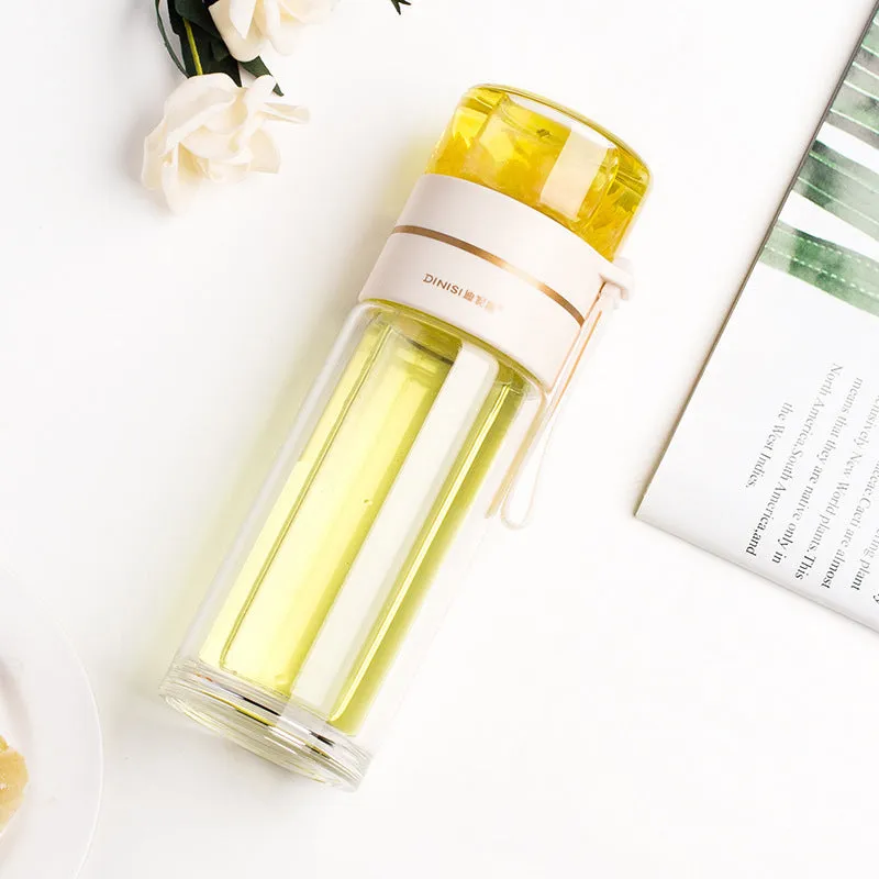Green double-wall glass water bottle with a stainless steel tea infuser insert and a black leak-proof lid with rope handle.