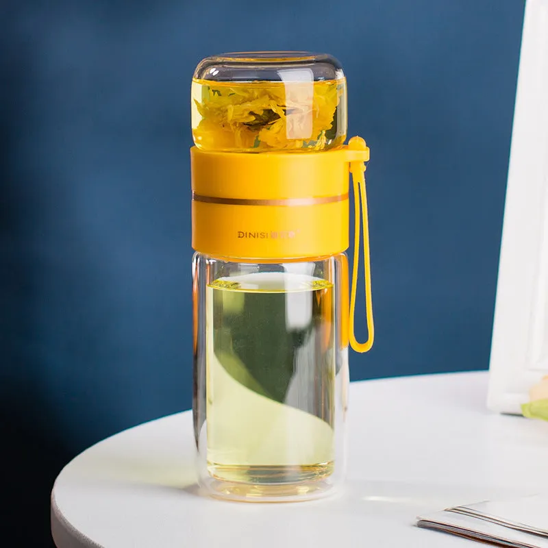 Green double-wall glass water bottle with a stainless steel tea infuser insert and a black leak-proof lid with rope handle.