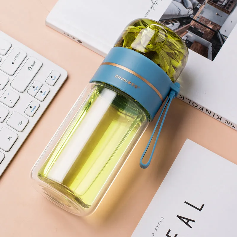 Green double-wall glass water bottle with a stainless steel tea infuser insert and a black leak-proof lid with rope handle.
