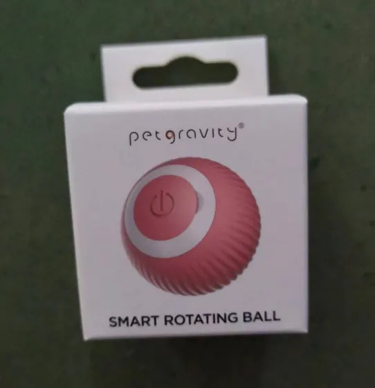 Small green plastic interactive rolling ball toy for cats with intelligent obstacle avoidance technology