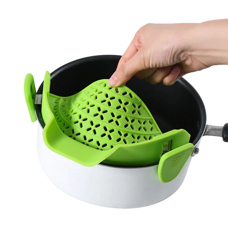 Silicone and stainless steel pot side drain stopper in multiple colours on a kitchen counter.