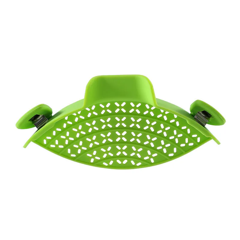 Silicone and stainless steel pot side drain stopper in multiple colours on a kitchen counter.
