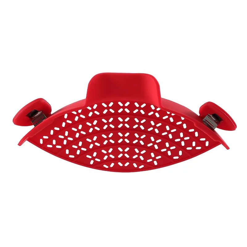Silicone and stainless steel pot side drain stopper in multiple colours on a kitchen counter.