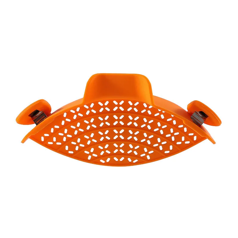 Silicone and stainless steel pot side drain stopper in multiple colours on a kitchen counter.