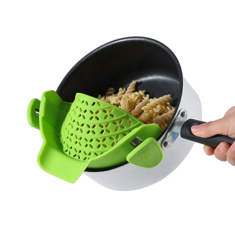 Silicone and stainless steel pot side drain stopper in multiple colours on a kitchen counter.