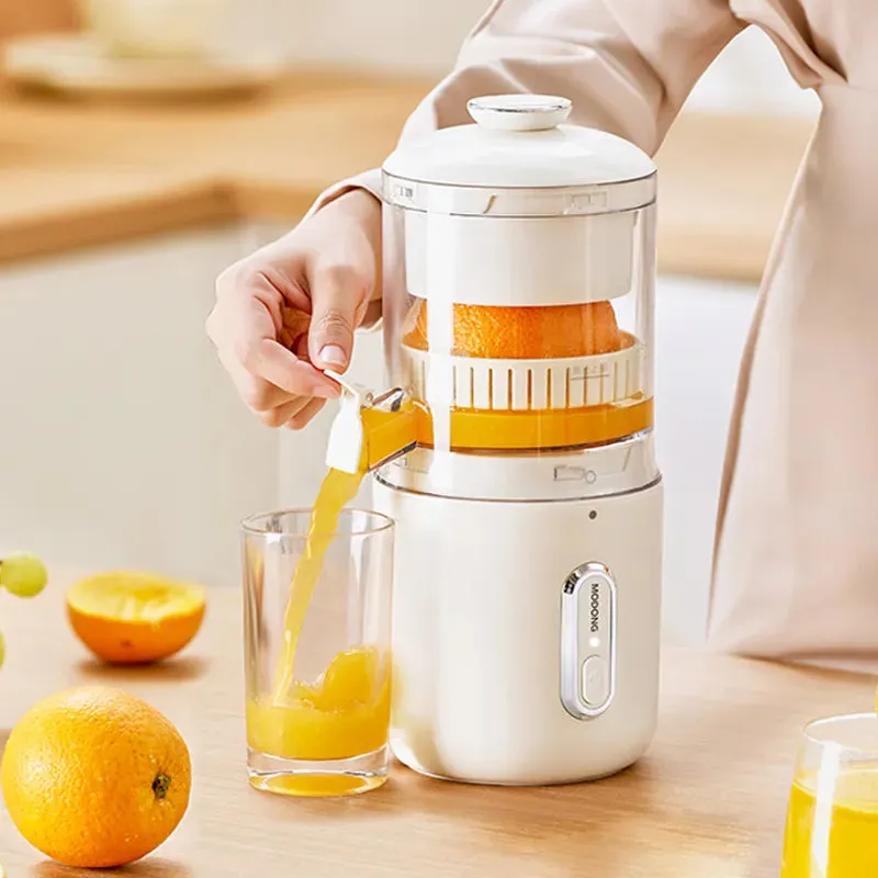 Fresh green portable USB electric juicer for oranges and lemons on a kitchen counter