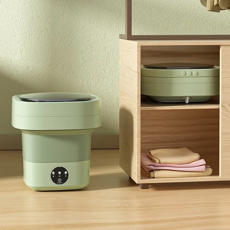 Foldable portable mini washing machine in green colour with drain pipe and basket