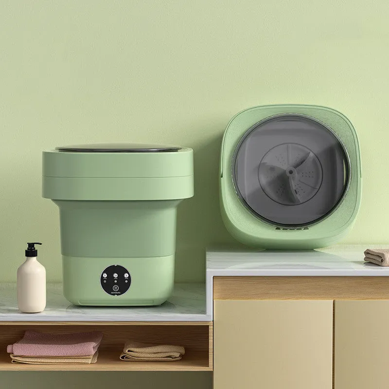 Foldable portable mini washing machine in green colour with drain pipe and basket