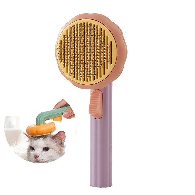 Hand-held pet grooming brush with curved stainless steel teeth in pumpkin colour option