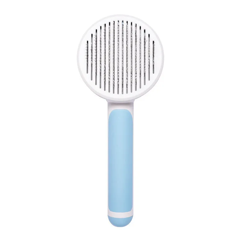 Hand-held pet grooming brush with curved stainless steel teeth in pumpkin colour option