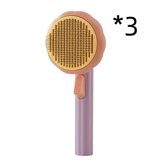 Hand-held pet grooming brush with curved stainless steel teeth in pumpkin colour option