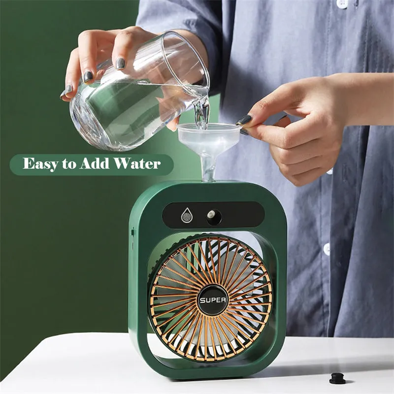 Green and white USB portable misting fan air cooler humidifier on a desk