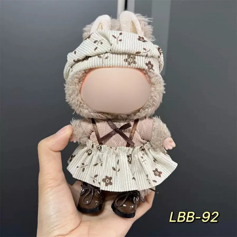 Plastic clothing costume for a 17cm tall vinyl doll figurine on display.