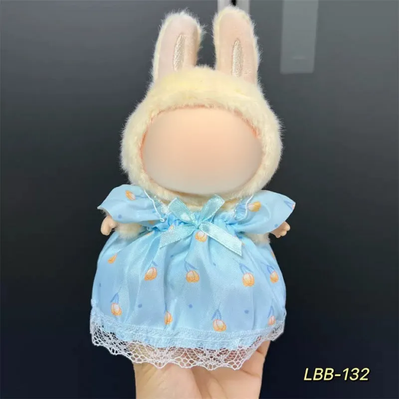 Plastic clothing costume for a 17cm tall vinyl doll figurine on display.