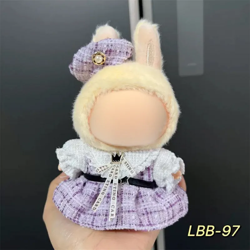 Plastic clothing costume for a 17cm tall vinyl doll figurine on display.