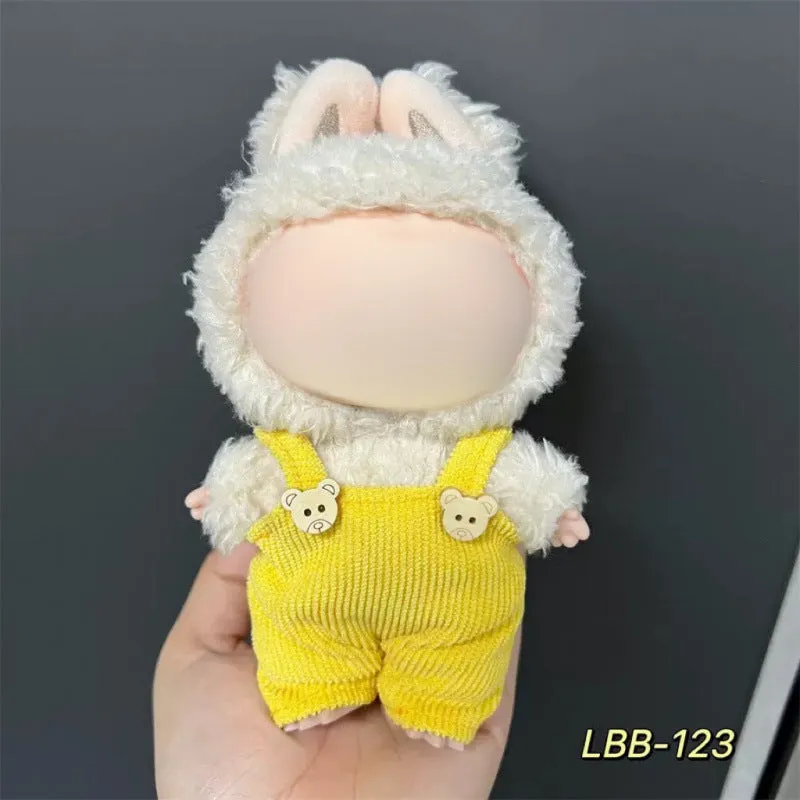 Plastic clothing costume for a 17cm tall vinyl doll figurine on display.