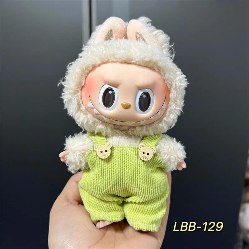 Plastic clothing costume for a 17cm tall vinyl doll figurine on display.