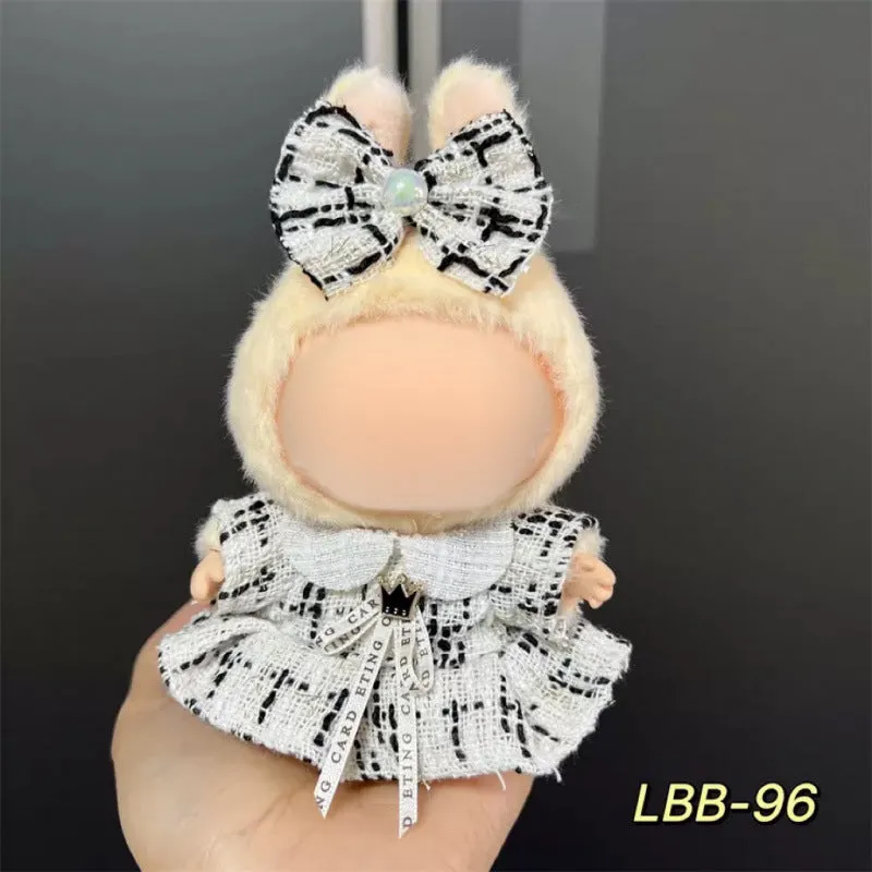Plastic clothing costume for a 17cm tall vinyl doll figurine on display.