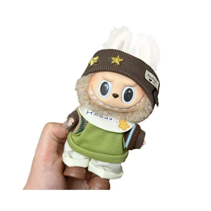 Plastic clothing costume for a 17cm tall vinyl doll figurine on display.