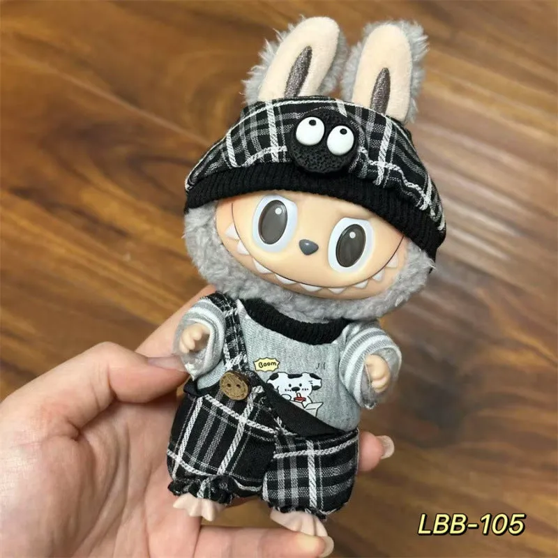 Plastic clothing costume for a 17cm tall vinyl doll figurine on display.