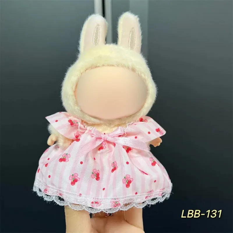Plastic clothing costume for a 17cm tall vinyl doll figurine on display.